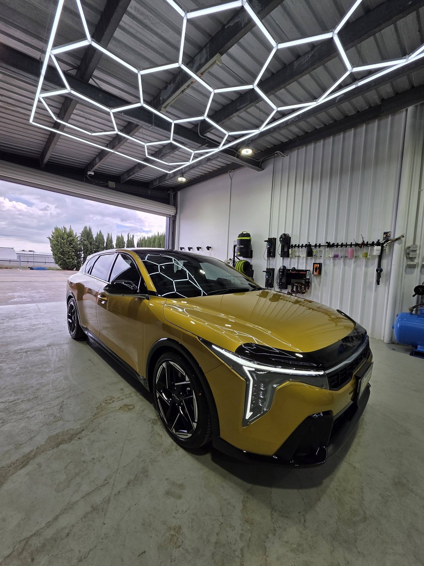 Ceramic coating Kelso - deep gloss finish reflecting workshop lighting
